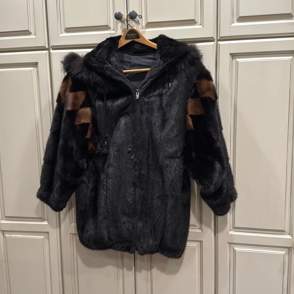 Female mink jacket with diamond pattern on sleeves